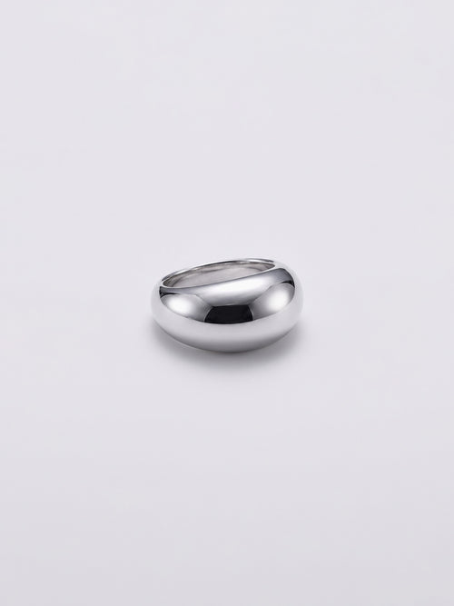 A polished silver dome ring with a smooth, rounded shape, photographed on a clean light gray background.