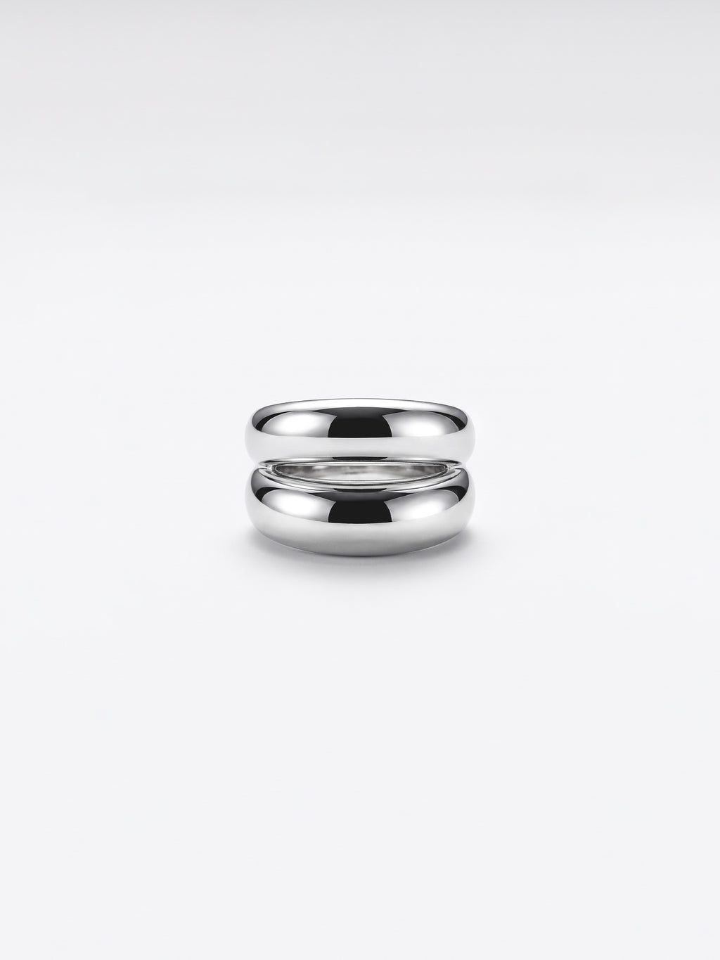 Double dome ring on a clean white studio background.